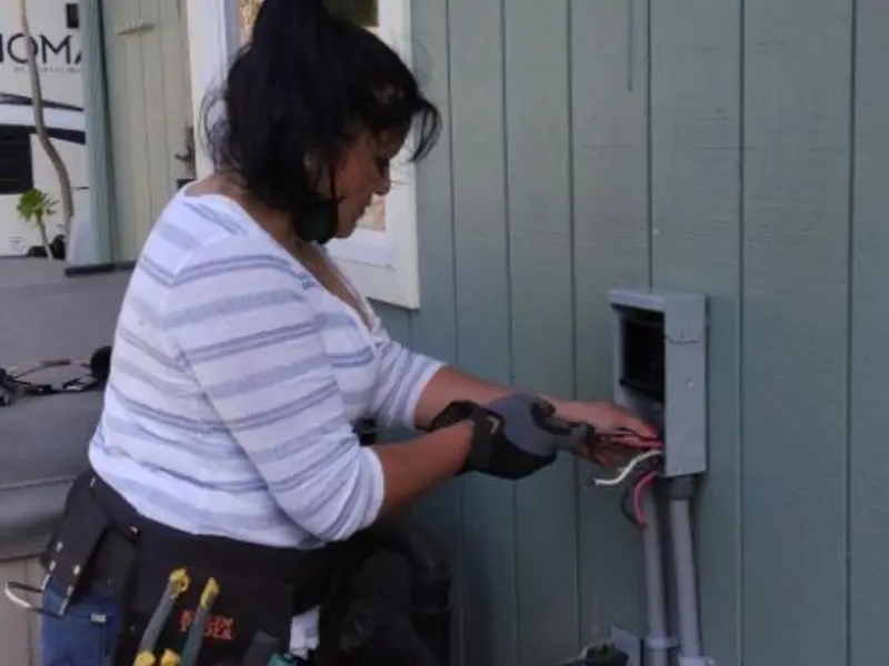 Licensed electrician wiring an exterior subpanel in Greenbelt